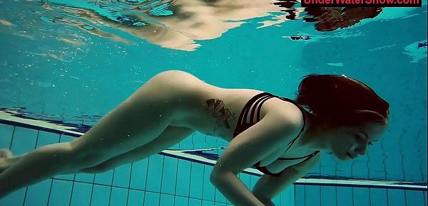  Tattooed baby swirls underwater